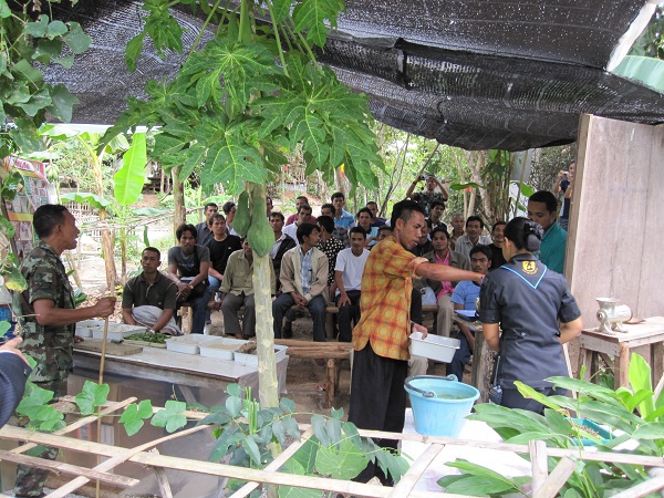 Military EM leaders giving lecture to farmers