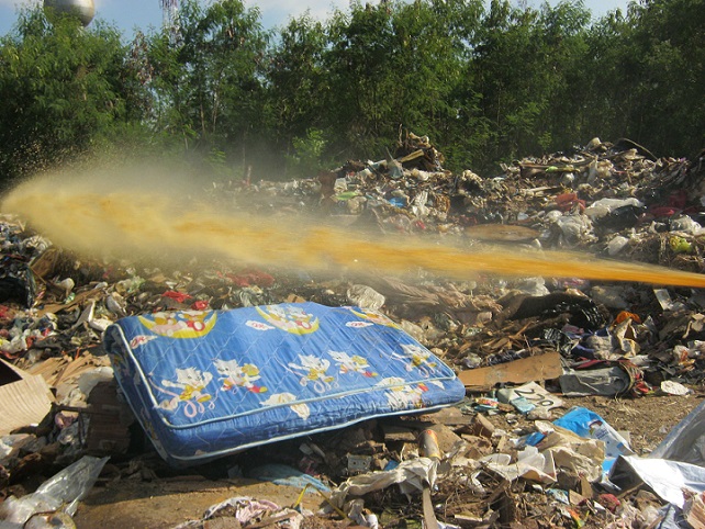 Spraying AEM to garbage collection site after the flood  to cope with the stench