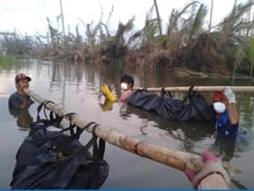 Crossing a river to bring dead bodies to the mass graves